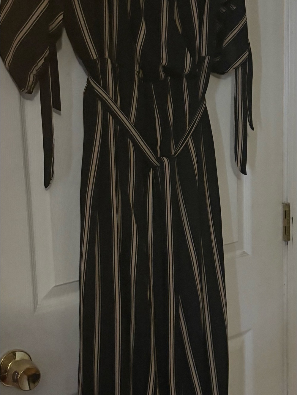 Avenue Black wide leg one piece with Cream Vertical Stripes.
